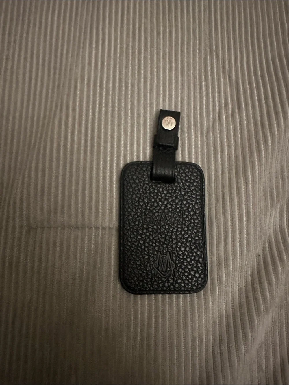 Rimowa black bookbag tag